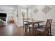 Dining room with hardwood floors and natural light from windows. Adjacent to the living room at 207 Harmony Lake Dr, Canton, GA 30115