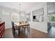 Elegant dining room with modern chandelier and open access to living area at 207 Harmony Lake Dr, Canton, GA 30115