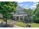 Charming two-story home featuring stone accents, manicured landscaping, and a welcoming front porch at 207 Harmony Lake Dr, Canton, GA 30115