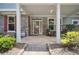 Inviting covered front porch with stone accents and space for seating at 207 Harmony Lake Dr, Canton, GA 30115