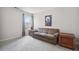 Simple living room with neutral walls, cozy seating, and natural light at 207 Harmony Lake Dr, Canton, GA 30115
