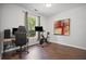 Office with desk, computer, exercise bike, and modern art at 207 Harmony Lake Dr, Canton, GA 30115
