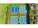 An overhead shot of the community tennis courts in a well-maintained area with green surroundings at 207 Harmony Lake Dr, Canton, GA 30115