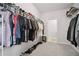 Large walk-in closet with ample storage and shelving for clothing and shoes at 207 Harmony Lake Dr, Canton, GA 30115