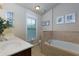 Bathroom with a double sink vanity, a large garden tub, and natural light from a window at 2107 Se Gorman Se Grv # 132, Atlanta, GA 30316