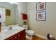 Clean bathroom with a sink, toilet, mirror, and simple decorations at 2107 Se Gorman Se Grv # 132, Atlanta, GA 30316