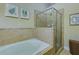 Bathroom featuring a tub and a glass enclosed shower at 2107 Se Gorman Se Grv # 132, Atlanta, GA 30316
