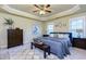 Spacious bedroom with tray ceiling, large windows, ceiling fan, and neutral decor at 2107 Se Gorman Se Grv # 132, Atlanta, GA 30316
