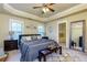 Bedroom featuring tray ceiling, carpet, and view to the primary bathroom at 2107 Se Gorman Se Grv # 132, Atlanta, GA 30316