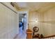 Upstairs hallway with pendant lighting, closet, and wooden railing at 2107 Se Gorman Se Grv # 132, Atlanta, GA 30316