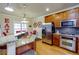 Bright kitchen featuring stainless steel appliances, a breakfast bar, and hardwood floors at 2107 Se Gorman Se Grv # 132, Atlanta, GA 30316
