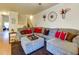 Comfortable living room with sectional sofa, ottoman, and view into an exercise room at 2107 Se Gorman Se Grv # 132, Atlanta, GA 30316