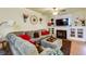 Cozy living room with a fireplace, TV, comfortable sectional, and hardwood floors at 2107 Se Gorman Se Grv # 132, Atlanta, GA 30316