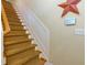 Carpeted stairway with wooden handrail, and an electronic home security system at 2107 Se Gorman Se Grv # 132, Atlanta, GA 30316