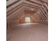 Unfinished attic space showing framing and a single window at 6861 Ga Hwy 5, Douglasville, GA 30135