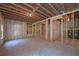 Spacious unfinished basement with exposed ceiling, studded walls, and water heaters at 6861 Ga Hwy 5, Douglasville, GA 30135