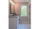 Bathroom featuring granite countertop vanity and tile floor at 6861 Ga Hwy 5, Douglasville, GA 30135