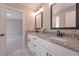 Bathroom featuring double granite countertop vanity and tile floor at 6861 Ga Hwy 5, Douglasville, GA 30135