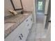 Stylish bathroom features granite countertop vanity and a marble tile floor at 6861 Ga Hwy 5, Douglasville, GA 30135