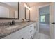 Stylish bathroom features double granite countertop vanity and a marble tile floor at 6861 Ga Hwy 5, Douglasville, GA 30135