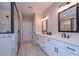 Spacious bathroom featuring a double vanity, walk-in shower, and large mirror at 6861 Ga Hwy 5, Douglasville, GA 30135