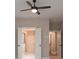 Bedroom with ceiling fan, neutral walls, and access to ensuite bath and closet at 6861 Ga Hwy 5, Douglasville, GA 30135