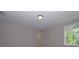 Bedroom featuring neutral paint, new windows, and updated lighting at 6861 Ga Hwy 5, Douglasville, GA 30135
