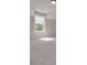 Bright bedroom featuring a window with natural light and neutral carpet at 6861 Ga Hwy 5, Douglasville, GA 30135