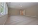 Spacious bonus room with plush carpet and a wall of windows letting in natural light at 6861 Ga Hwy 5, Douglasville, GA 30135