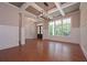 Formal dining area with hardwood floors, coffered ceiling, and large windows at 6861 Ga Hwy 5, Douglasville, GA 30135