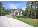 Beautiful home featuring a long drive and lush green lawn at 6861 Ga Hwy 5, Douglasville, GA 30135
