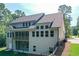 Rear exterior view of home featuring a deck, walkout basement, and large windows at 6861 Ga Hwy 5, Douglasville, GA 30135