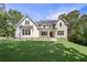Beautiful two-story home featuring a manicured lawn and a welcoming front porch at 6861 Ga Hwy 5, Douglasville, GA 30135