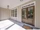 Welcoming covered front porch with double doors and classic lighting fixtures at 6861 Ga Hwy 5, Douglasville, GA 30135