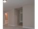 A glimpse of a hallway with white walls leading to the main bedroom at 6861 Ga Hwy 5, Douglasville, GA 30135