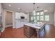 Beautiful open kitchen featuring a large island, white cabinets, and stainless steel appliances at 6861 Ga Hwy 5, Douglasville, GA 30135