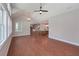 Open-concept living area with hardwood flooring, vaulted ceilings, and lots of natural light at 6861 Ga Hwy 5, Douglasville, GA 30135