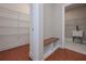 Well-organized mudroom with a built-in bench, shelving, and easy access to the laundry area at 6861 Ga Hwy 5, Douglasville, GA 30135