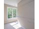 Walk-in closet with window and white wire shelving for storage at 6861 Ga Hwy 5, Douglasville, GA 30135