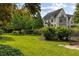 Beautiful home featuring a spacious backyard, lush greenery, and meticulous landscaping at 1 Brookhaven Ne Dr # 205, Atlanta, GA 30319