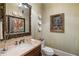 Charming powder room with a framed mirror and classic fixtures at 1 Brookhaven Ne Dr # 205, Atlanta, GA 30319