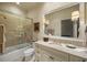 Bright bathroom with vanity and shower-tub combo at 1 Brookhaven Ne Dr # 205, Atlanta, GA 30319