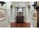 Charming hallway with arched doorways, framed artwork, and decorative table at 1 Brookhaven Ne Dr # 205, Atlanta, GA 30319