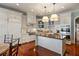 Gourmet kitchen featuring custom white cabinets, a center island, and stainless steel appliances at 1 Brookhaven Ne Dr # 205, Atlanta, GA 30319