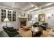 Elegant living room with fireplace, custom built-ins, and comfortable seating perfect for relaxation at 1 Brookhaven Ne Dr # 205, Atlanta, GA 30319
