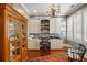 Home office with custom built-ins, wood floors, and a classic chandelier at 1 Brookhaven Ne Dr # 205, Atlanta, GA 30319