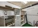 Organized storage area with shelving and ample space for storage containers and other household items at 1 Brookhaven Ne Dr # 205, Atlanta, GA 30319