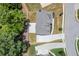 An aerial view of a well-maintained gray roof two-story home and long driveway in a lovely neighborhood at 1620 Brook Ivy Dr, Lawrenceville, GA 30044
