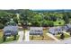 Aerial view of neighborhood featuring two-story home and landscaping in a lush, wooded area at 1620 Brook Ivy Dr, Lawrenceville, GA 30044