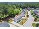 Aerial view of a two-story home in a lush neighborhood with a long driveway at 1620 Brook Ivy Dr, Lawrenceville, GA 30044